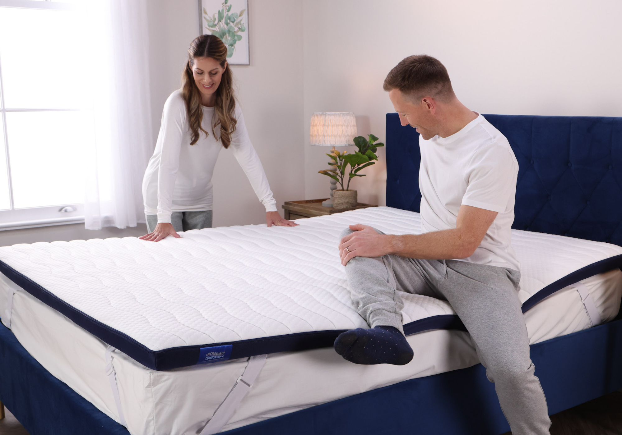 A couple testing out their Seriously Comfortable Revolution Mattress Topper that provides customisable comfort and eliminates 100% of pressure hot spots all encased in a washable, anti bacterial cover 