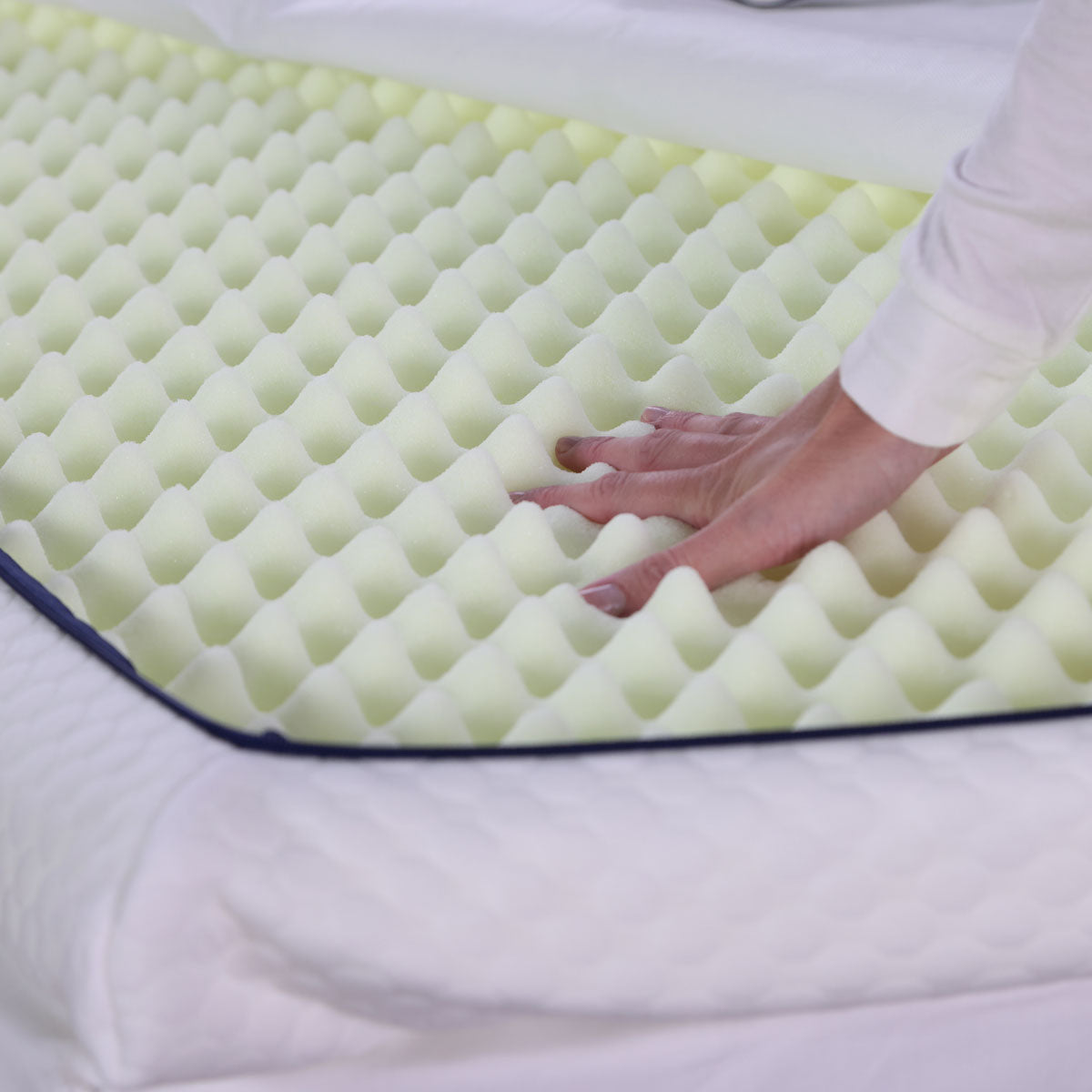 The firmer massaging side of the Seriously Comfortable Cool Revive mattress topper core 