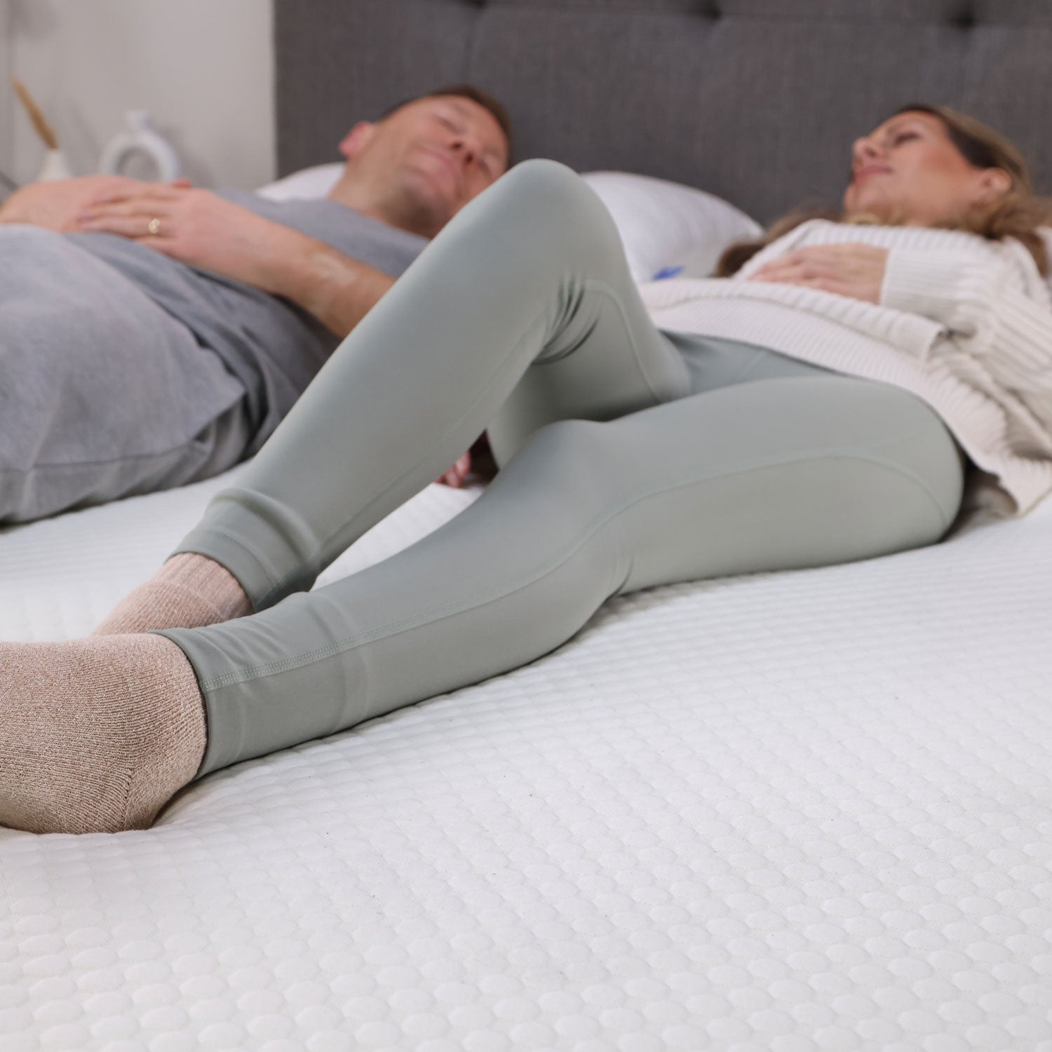 A couple testing out their Seriously Comfortable Revive Plus mattress topper that providing customisable comfort against aches and pains 