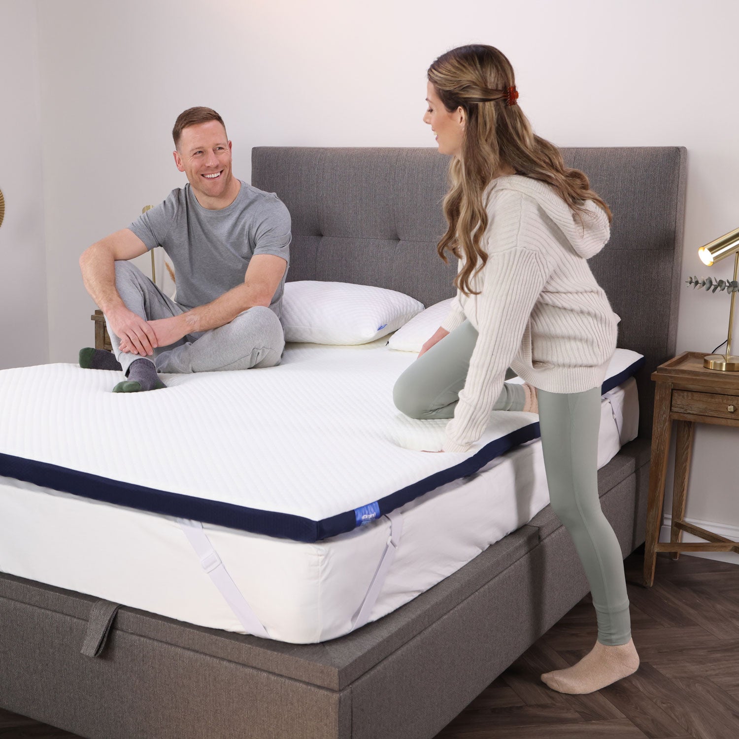 A couple testing out their Seriously Comfortable Revive Plus mattress topper that providing customisable comfort against aches and pains 